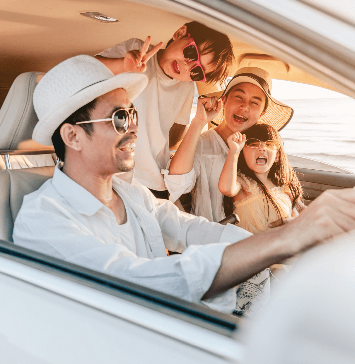 Famiily of four enjoying travelling in the car journey